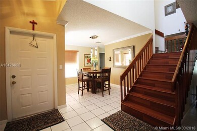 The family room and formal dining room join near t