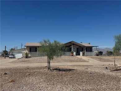 Single story home featuring a porch and a mountain view