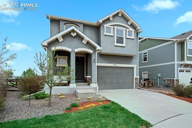 View of front of property with a garage, driveway,