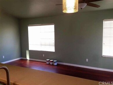Lots of natural lighting, rich wood laminate floor
