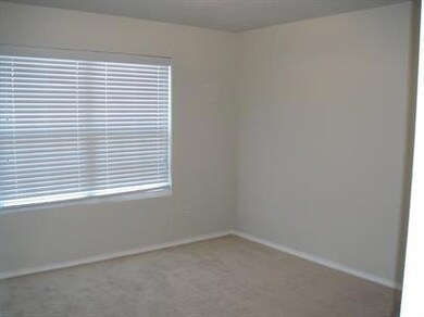 Unfurnished room with carpet