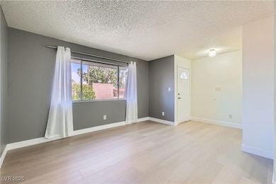 Freshly painted living room w/ new Luxury Vinyl Pl