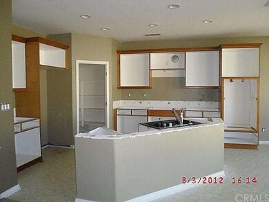 Kitchen missing all appliances, countertops, doors