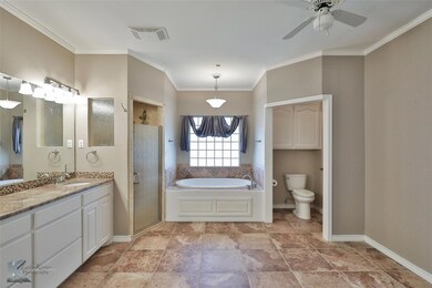 Full bathroom with vanity, crown molding, toilet, 