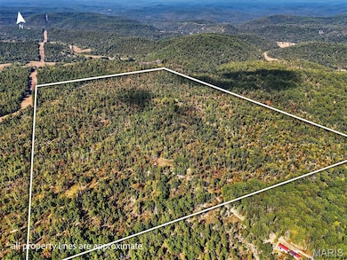 View of property location featuring property boundaries highlighted and a mountain backdrop