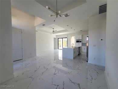 Unfurnished living room with ceiling fan with nota