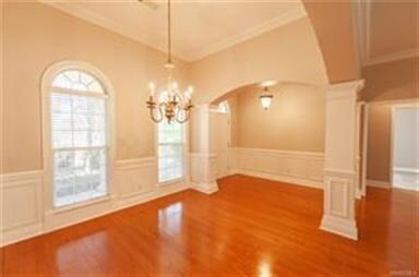 Formal dining room.  Open concept with arched entr