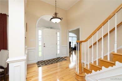 Entrance foyer featuring light wood-style flooring