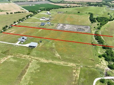 Birds eye view of property with a rural view