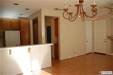 Living space is open with breakfast bar to kitchen