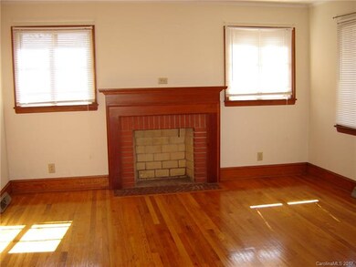 Living Room with fireplace.  Fireplace has never b