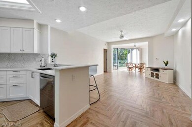 Kitchen with kitchen peninsula, stainless steel di