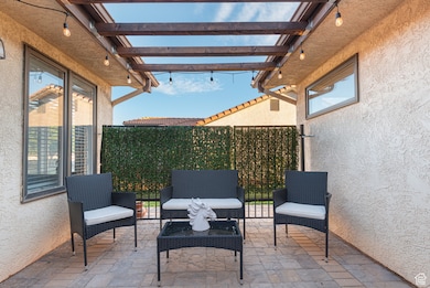 View of patio featuring a pergola and an outdoor hangout area