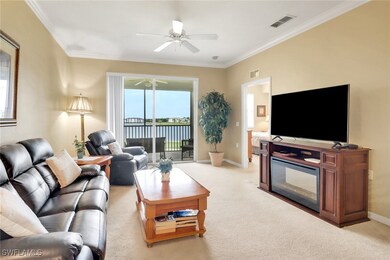 Living room featuring light carpet, a ceiling fan,