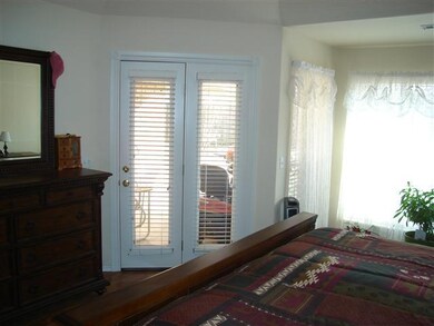 Master Bedroom. Sitting area and access to the pat