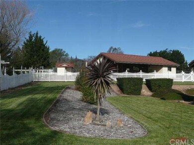 Lovely landscaping surrounds this home. Barn/works