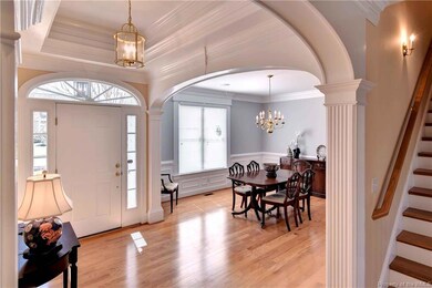 Exquisite trim welcomes you into this lovely foyer