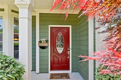 Entrance to property featuring covered porch!  Enj