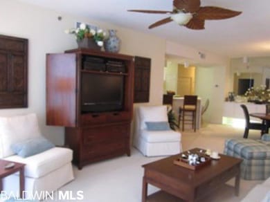 Floor to ceiling glass, large flat screen television.