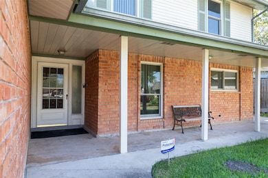 Covered front porch to enjoy the view of your palm