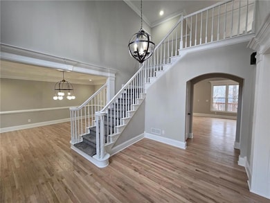 Stairway featuring hardwood / wood-style floors, a