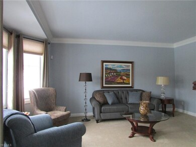 Formal Living Room w/Crown Molding & Window Treatm