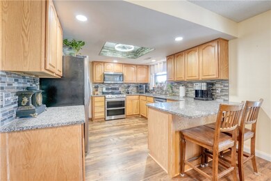 Updated Eat-In Kitchen with Granite Counters and l