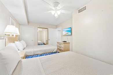 Bedroom featuring ceiling fan and a closet