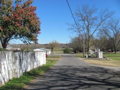 This street scene view shows the intersection of Bakerville Road and Sycamore Landing Road. Enjoy your daily walk down the country road that ends at the Tennessee River! 