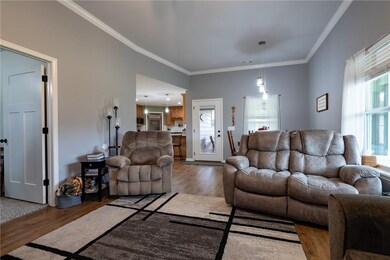Great room facing kitchen and rear door to amazing