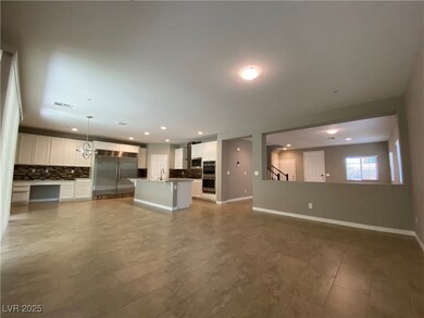Unfurnished living room with baseboards and recessed lighting