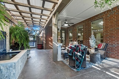 Expansive covered outdoor living space perfect for morning coffee.
