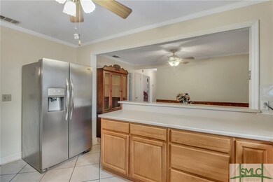 Open to the kitchen is the light and bright dining