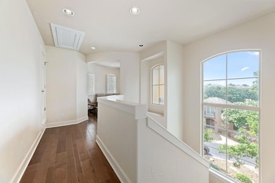 Hallway with attic access, plenty of natural ligh