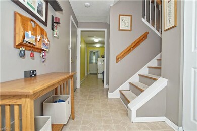 Entryway with coat closet leads through to the fir