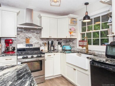 Kitchen with grey subway tile back splash
