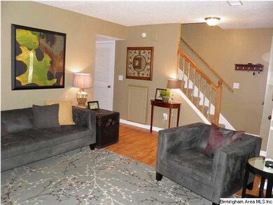 Gleaming hardwood laminate throughout main level (
