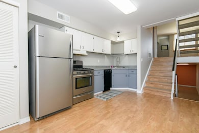 Kitchen appliances and stairs