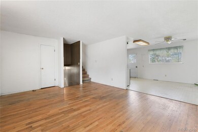 Living Room flows into the Dining Room which featu