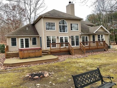 Large multi-tiered deck with hot tub off the first