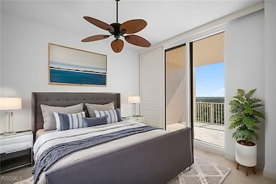 Carpeted bedroom with access to exterior and ceiling fan