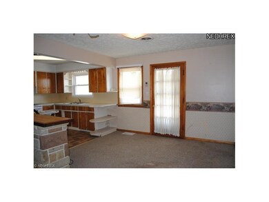Kitchen/Dinette with door to the deck and backyard