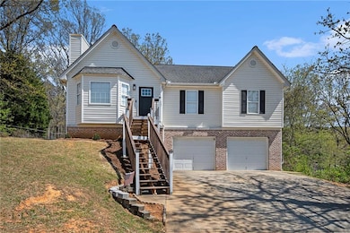 View of front of property featuring concrete drive