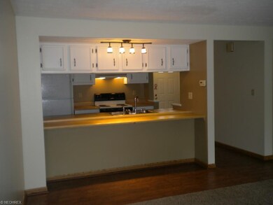 Wood laminate floor with area for bar stools benea
