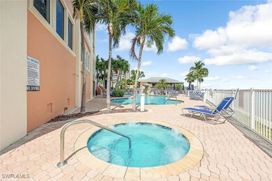 View of swimming pool featuring a community hot tu