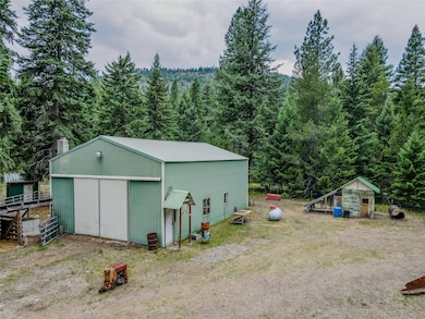 View of pole building featuring a forest view