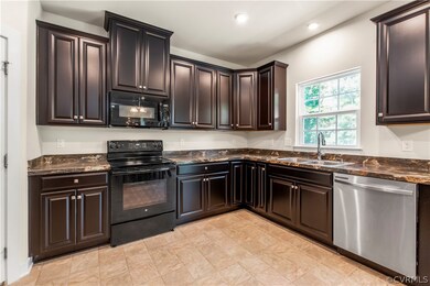 The kitchen has loads of cabinets and cupboards fo