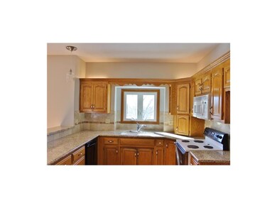 Another view of the kitchen and the granite counte