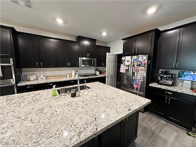 Kitchen with appliances with stainless steel finis