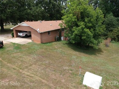 Another view of carport side of property.